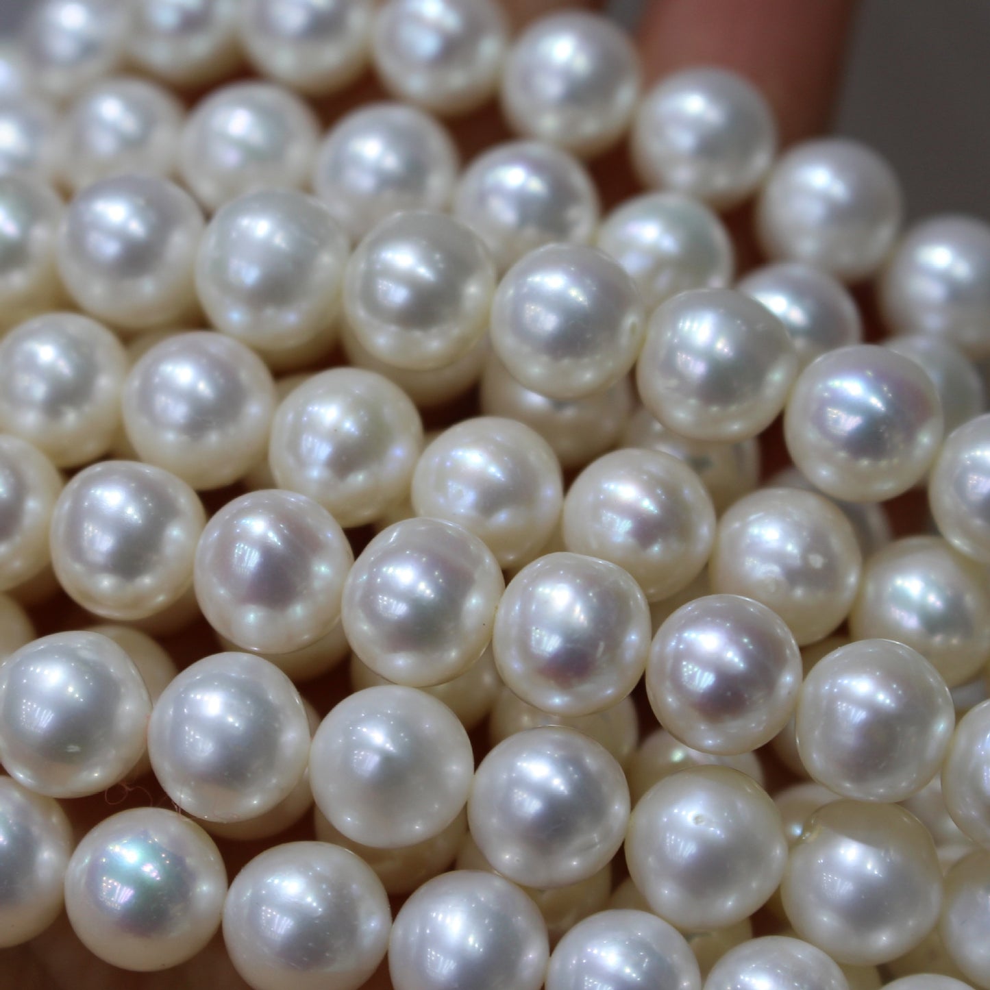 White color near round freshwater pearl strands